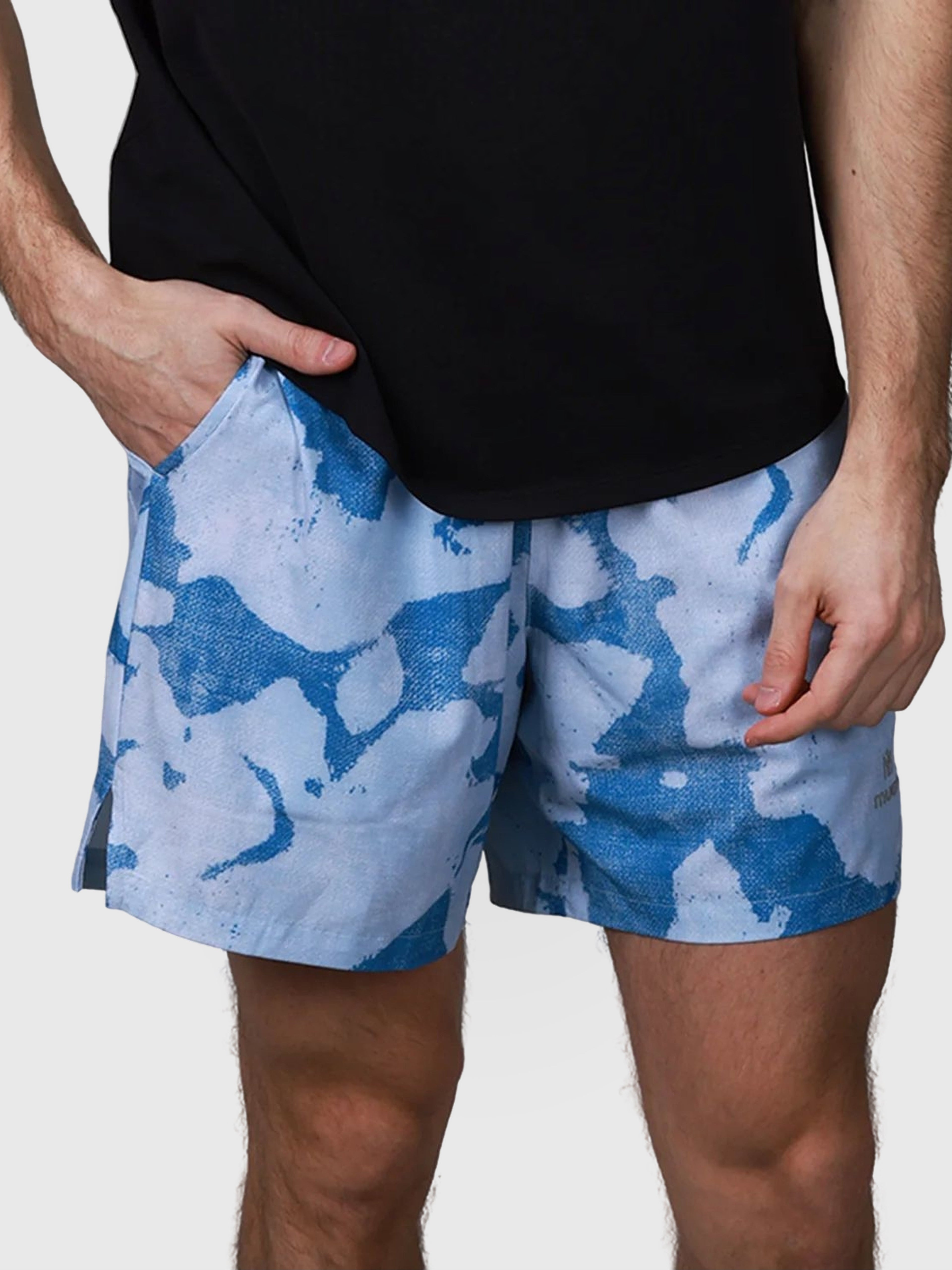 Front view of blue Base Line Short by MUEV in abstract pattern designed for padel and pickleball clothing