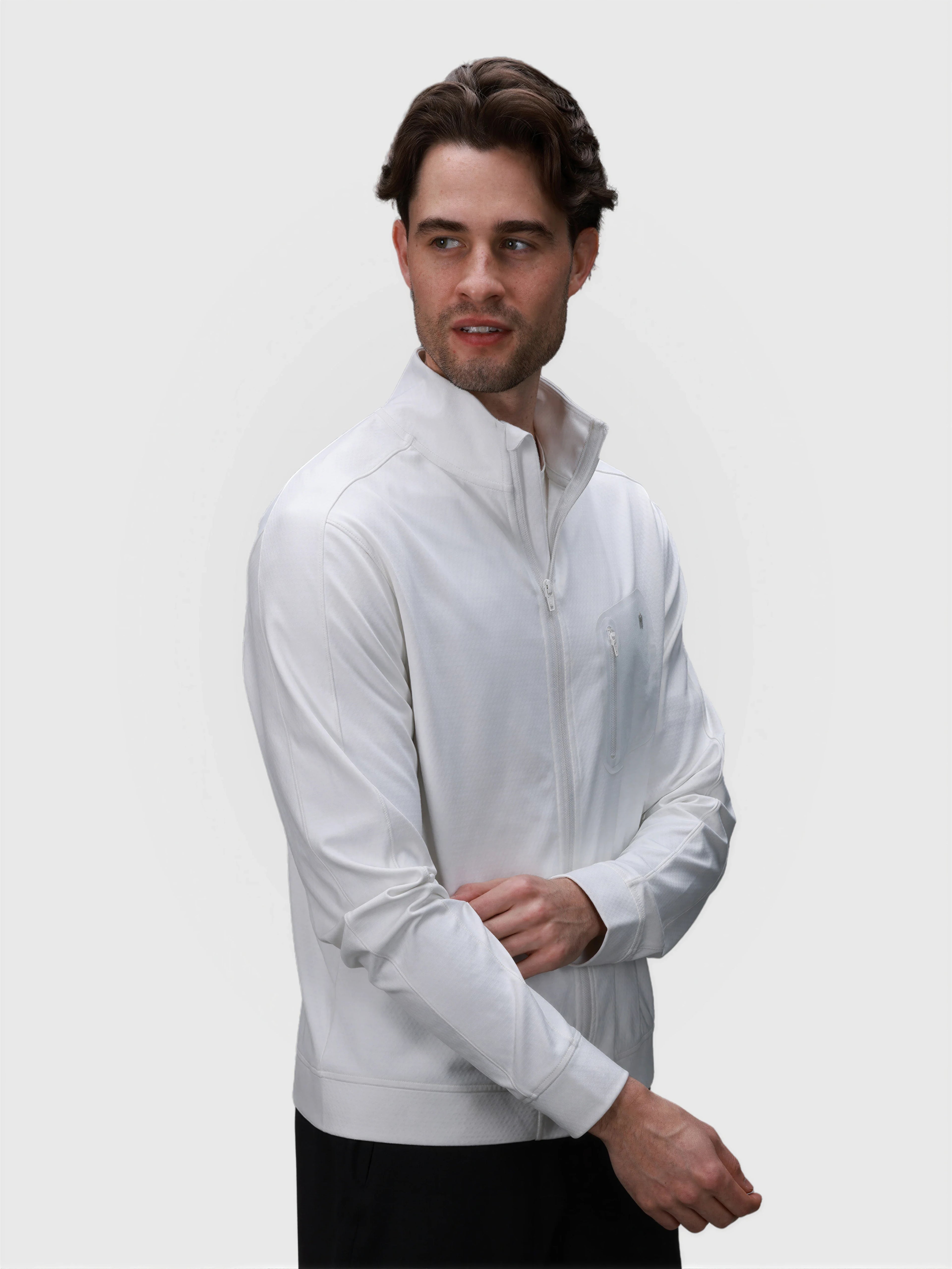 Man wearing white Echelon Jacket with zippered chest pocket in pickleball apparel by MUEV