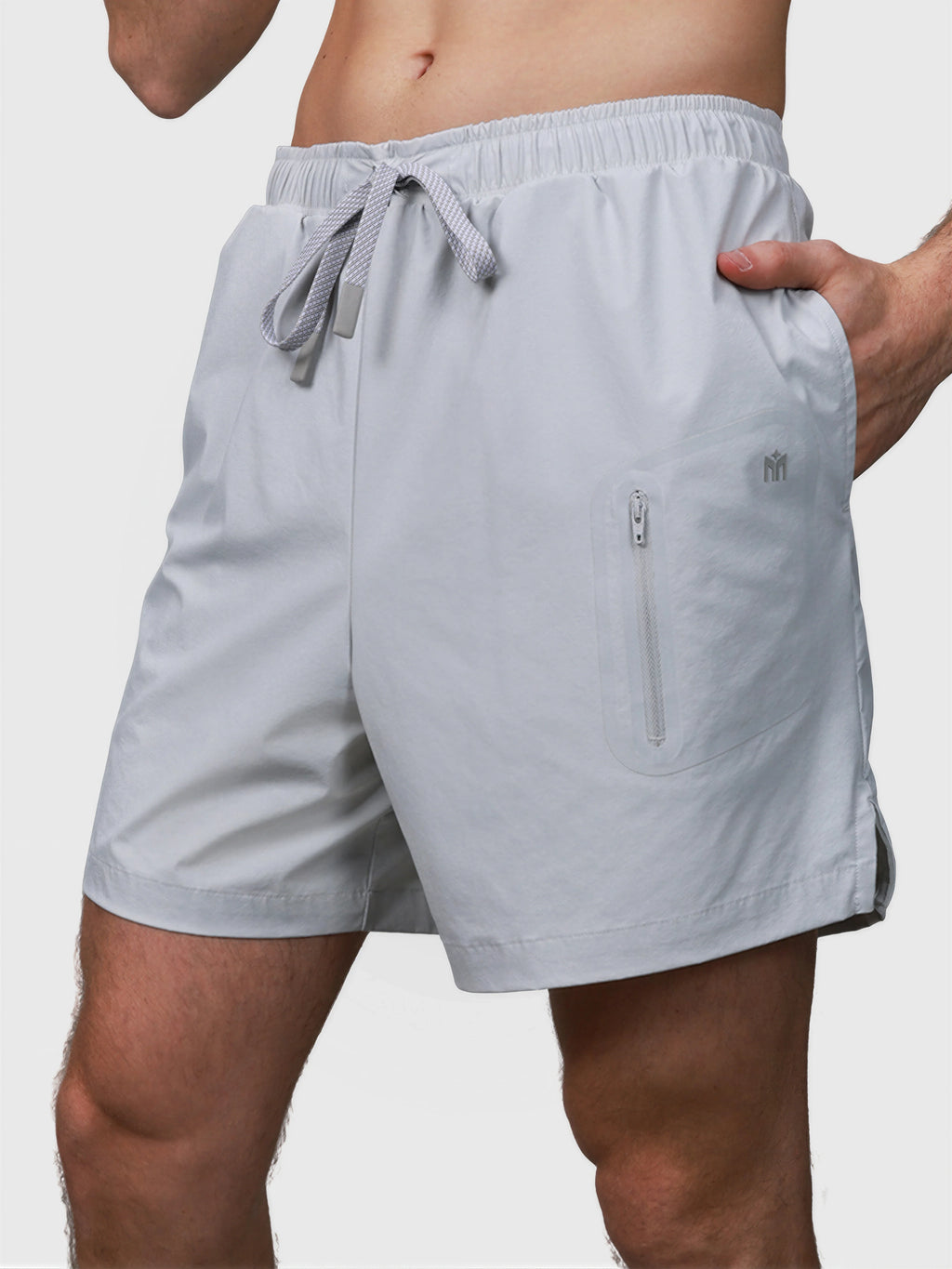 Gray Apex Pro Compression Short by MUEV with elastic waistband and zippered pocket for padel apparel