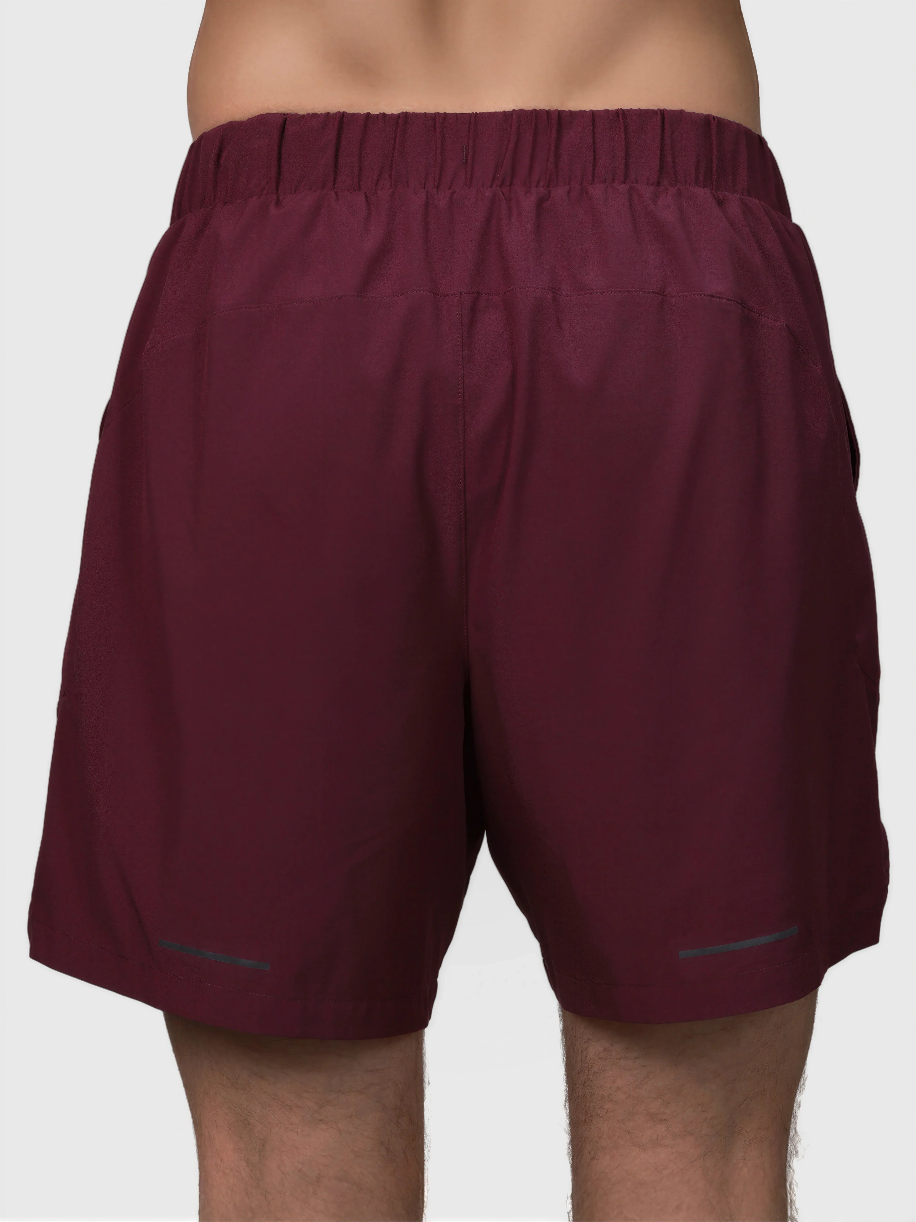 Back view of plum Base Line Short by MUEV designed for padel and pickleball apparel with elastic waistband