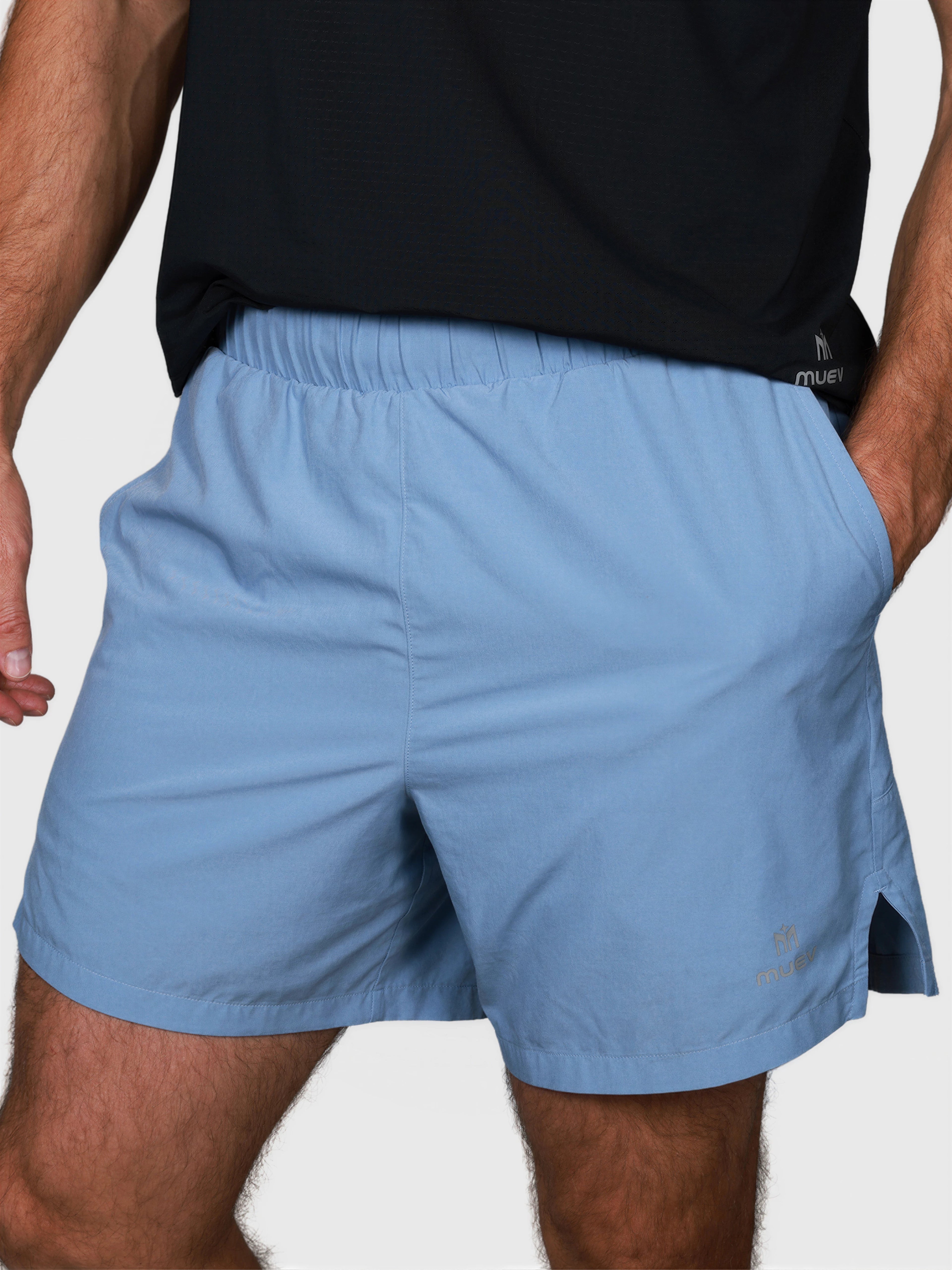 front close-up of man wearing Cloud Blue Base Line Short by MUEV designed for pickleball and padel apparel