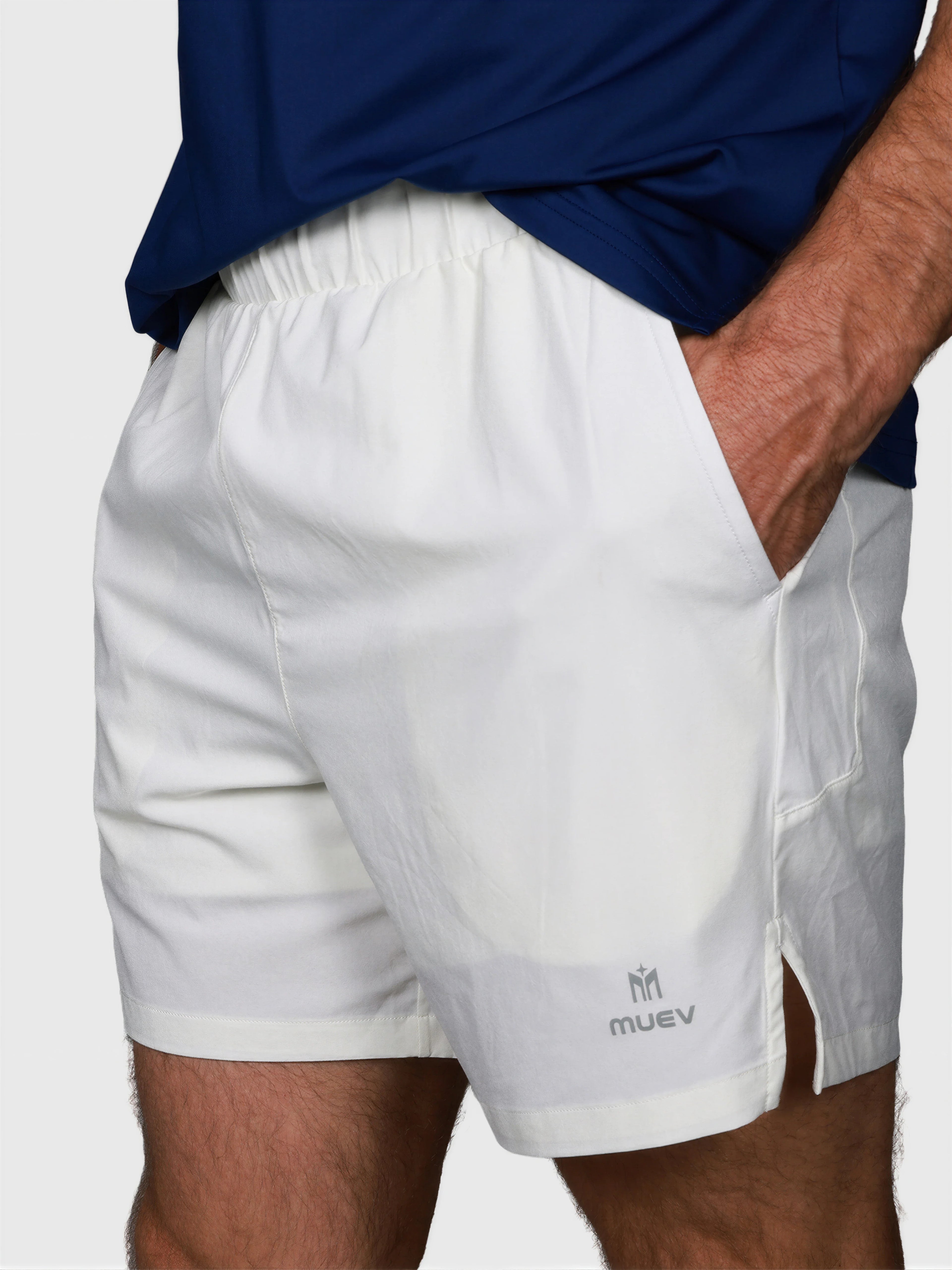 close-up front view of man wearing white Base Line Short by MUEV designed for pickleball and padel clothing
